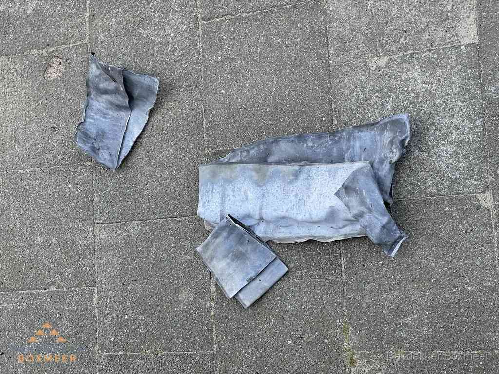 Oude verwijderde loodslabben na vervanging in Boxmeer Oude verwijderde loodslabben na vervanging in Boxmeer